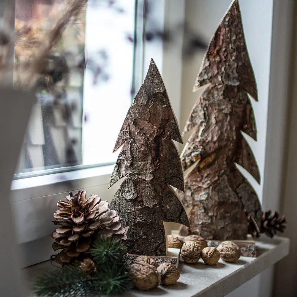 Rustic Bark-Covered Christmas Tree Shapes on a Windowsill Rustic Bark-Covered Christmas Tree Shapes on a Windowsill — Rustic Christmas Tree