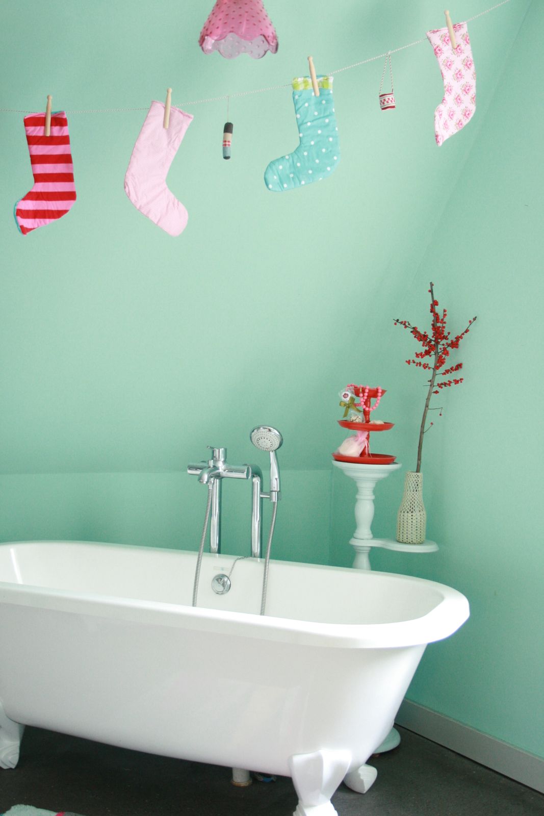 Playful Christmas Stockings Hung in Mint Green Bathroom — Christmas Bathroom Decor