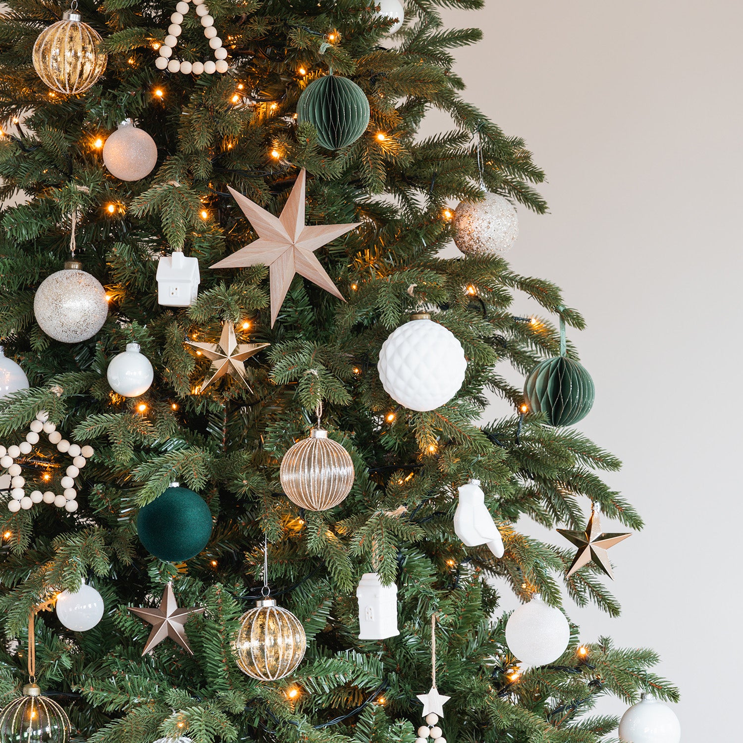 Modern Minimalist Christmas Tree with Varied Ornaments — Elegant Christmas Decor