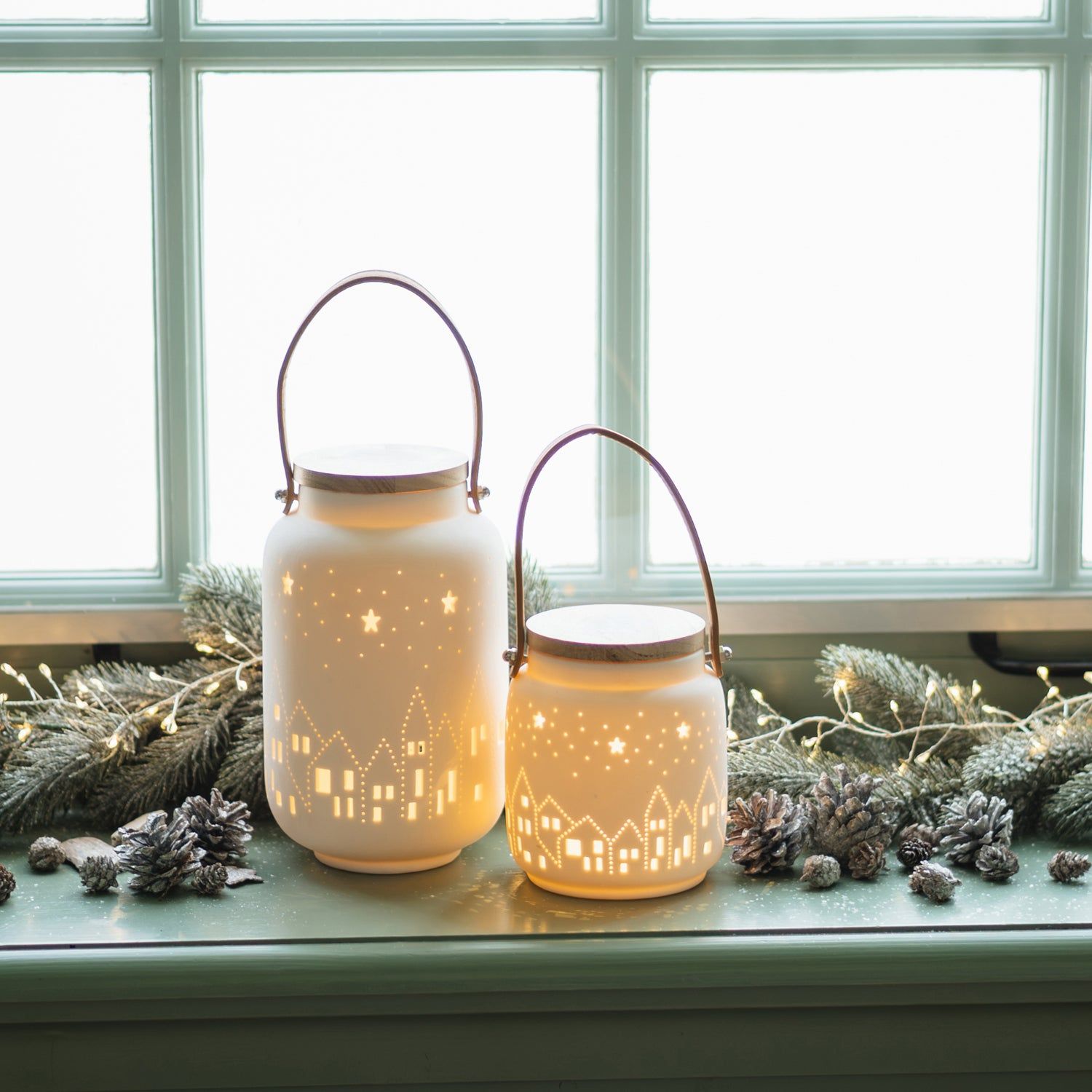 Minimalist Porcelain Lanterns with Glowing Village Designs on Windowsill — Christmas Lantern Lights