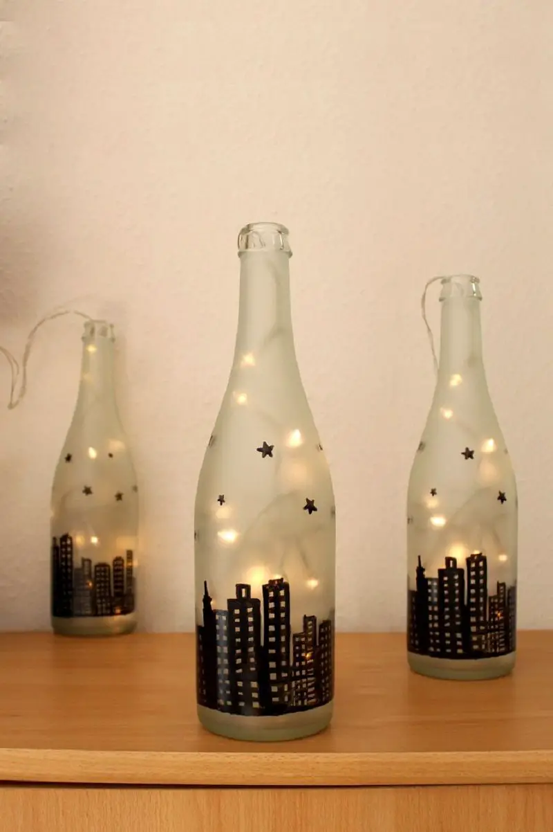 Frosted Glass Bottles with City Skyline Silhouette Lights Frosted Glass Bottles with City Skyline Silhouette Lights — Christmas Light Display Ideas