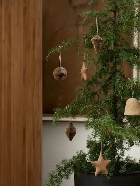 Delicate Paper Ornaments on a Small Tree Delicate Paper Ornaments on a Small Tree — Small Christmas Tree Decor