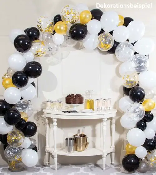 Black, White, and Gold Balloon Arch Over a Decorated Table — New Years Eve Balloon Garland