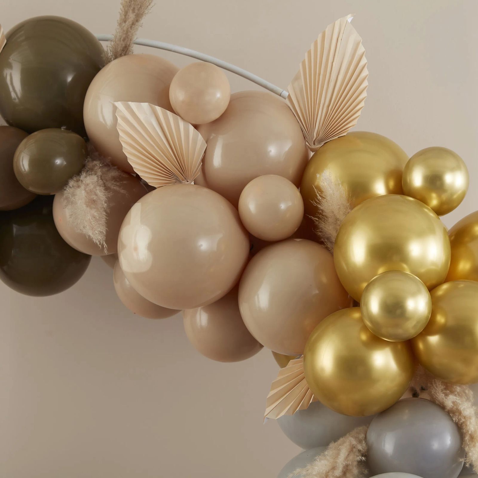 Modern Nude and Gold Balloon Garland Draped Over Metal Hoop — New Years Eve Balloon Garland