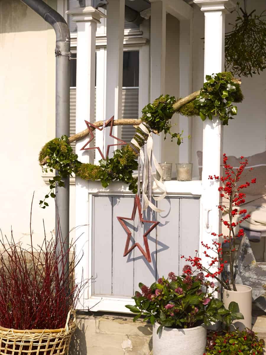 Hanging Natural Star Ornaments on Porch — Winter Front Door Decor