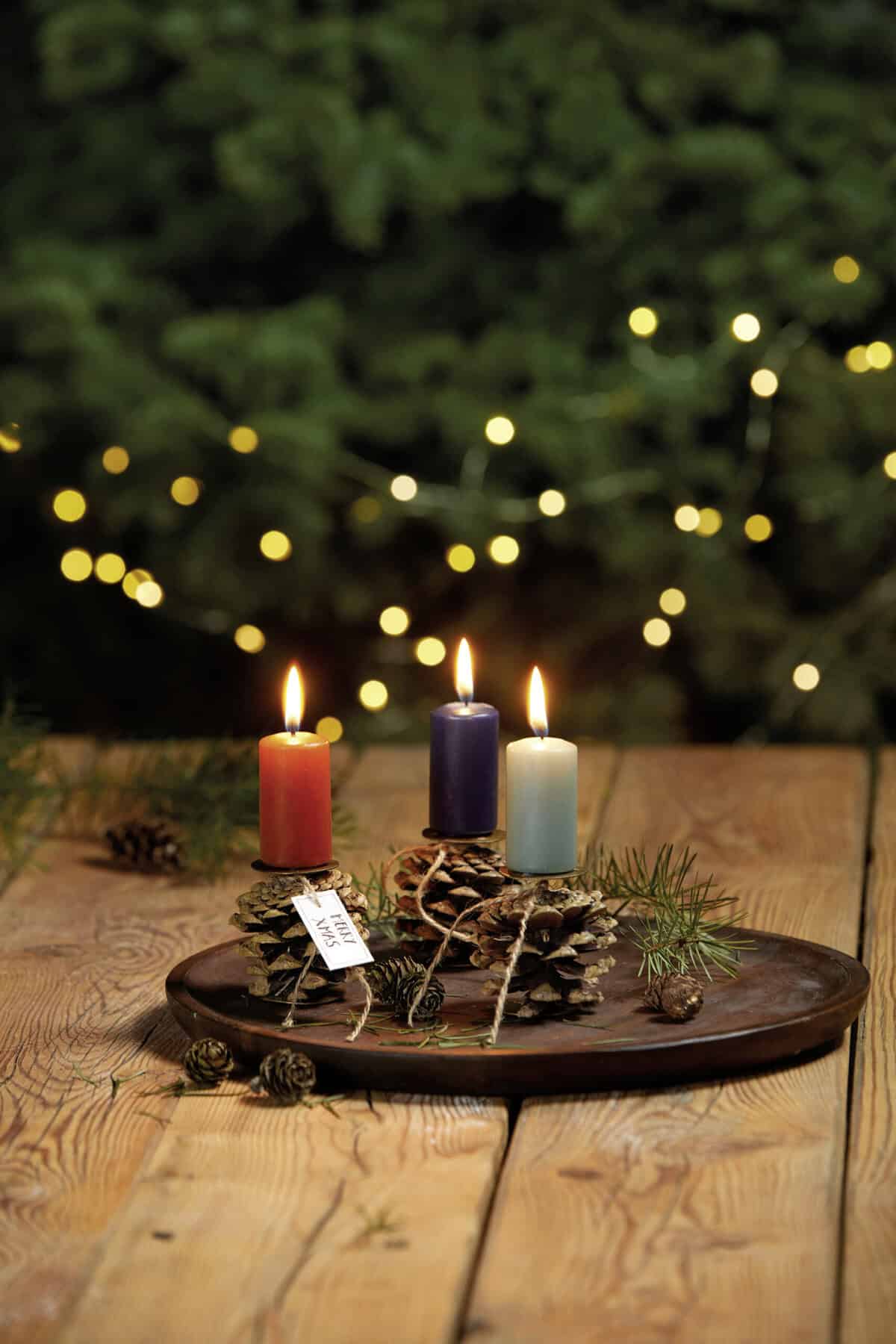 Rustic Wooden Tray with Colorful Advent Candles on Pine Cone Bases — Christmas Candle Decor