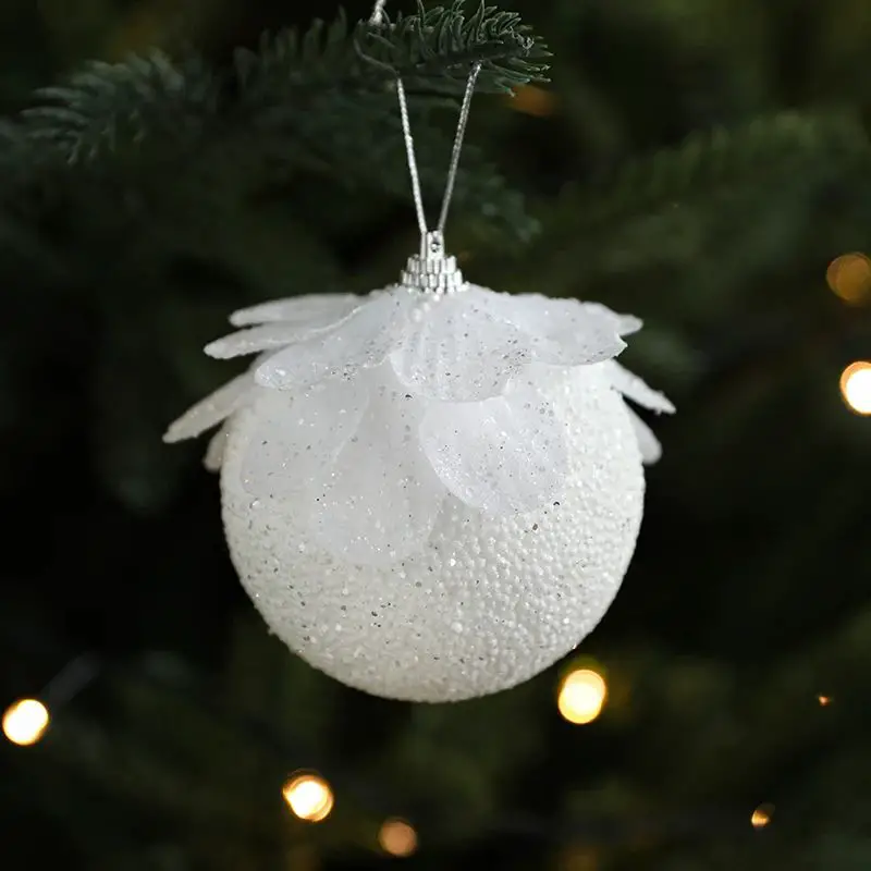 White Glitter Bauble Ornament on a Christmas Tree Branch White Glitter Bauble Ornament on a Christmas Tree Branch — White Christmas Tree Decor