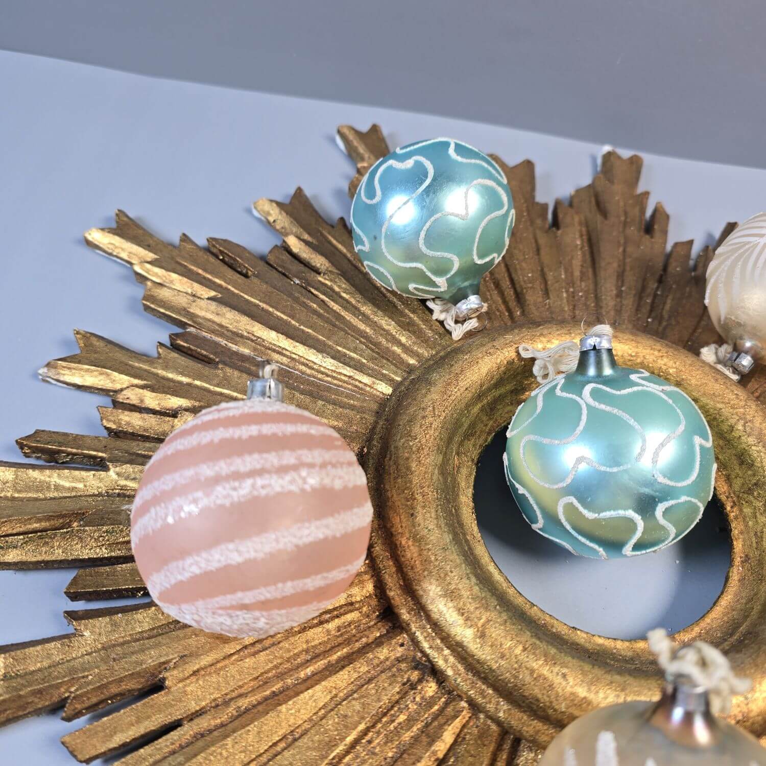 Teal and Pink Ornaments on a Sunburst Mirror Teal and Pink Ornaments on a Sunburst Mirror — Vintage Christmas Ornaments
