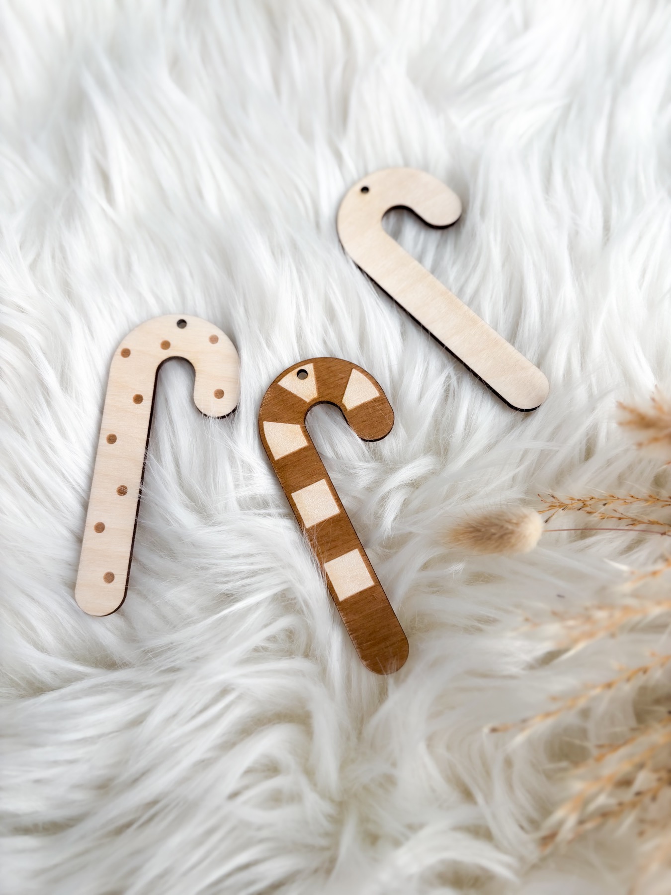 Natural Wood Candy Cane Ornaments on a Fluffy Rug — Candy Cane Christmas Tree