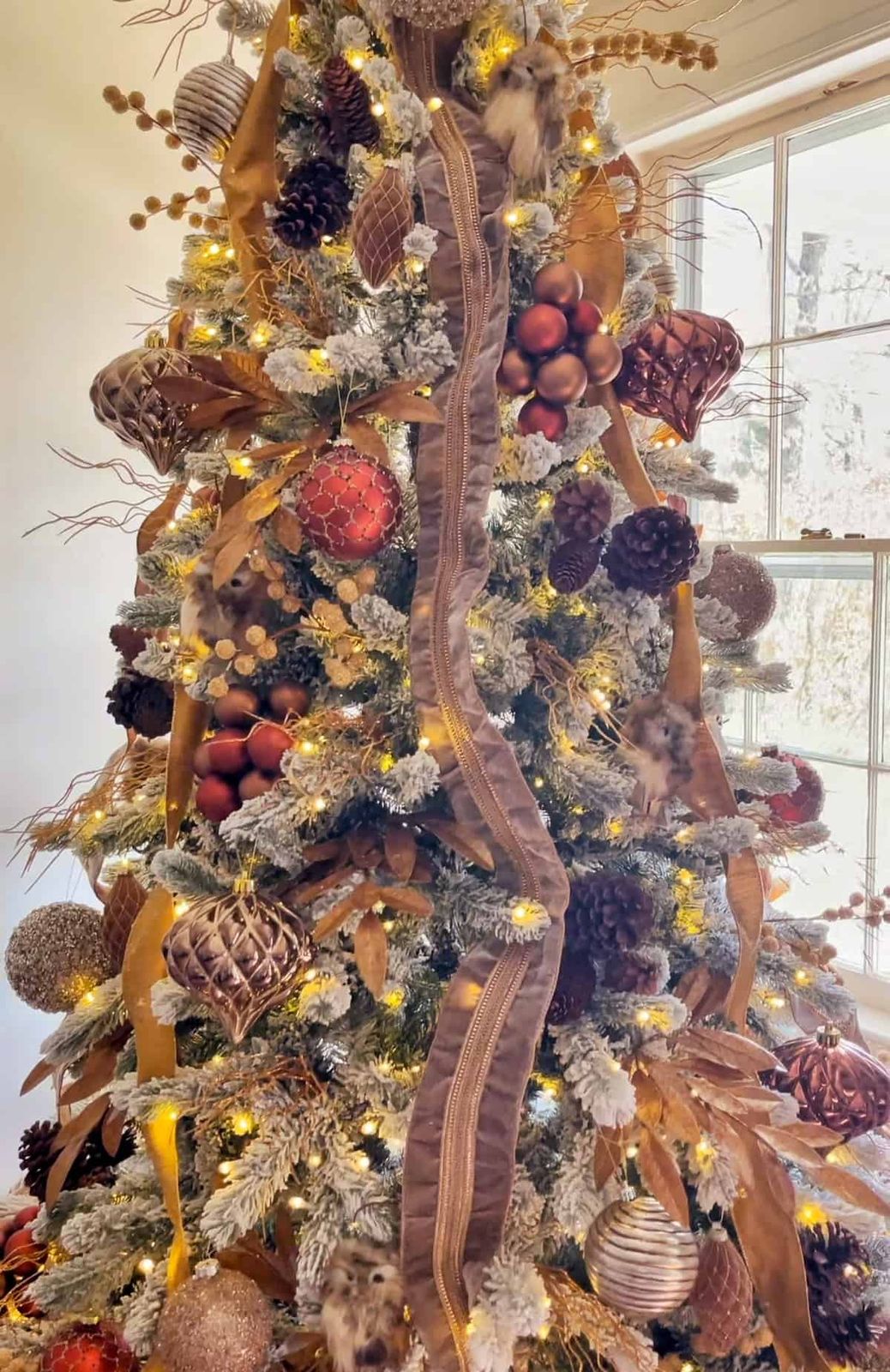 Elaborate Flocked Tree with Velvet Ribbon and Pinecones Elaborate Flocked Tree with Velvet Ribbon and Pinecones — Flocked Christmas Tree Decor
