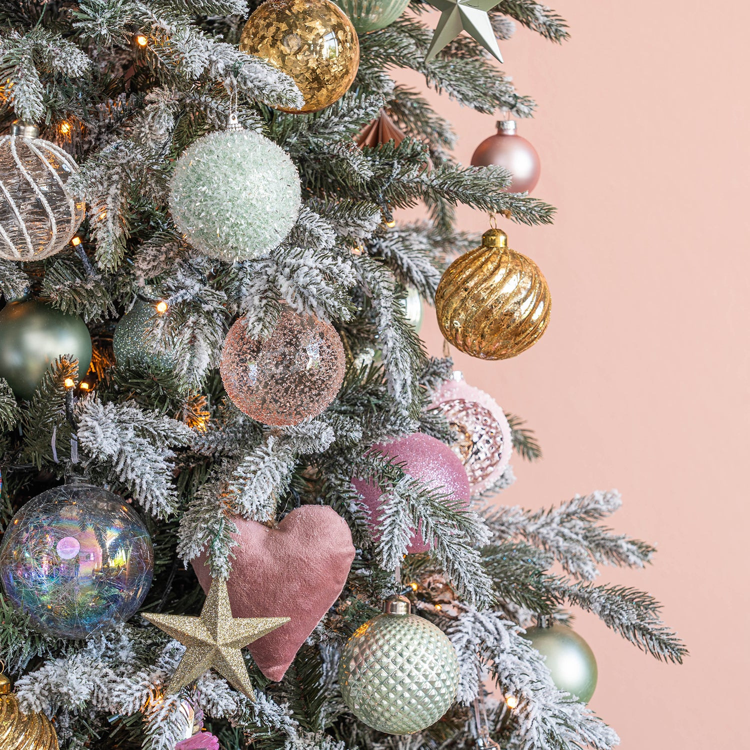 Sparkling Pink, Green, and Gold Baubles on a Flocked Christmas Tree — Glam Christmas Tree