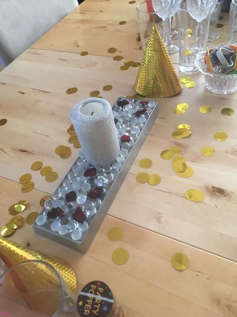 Festive Centerpiece with Gold Party Hat and Candle — New Years Eve Party 2027