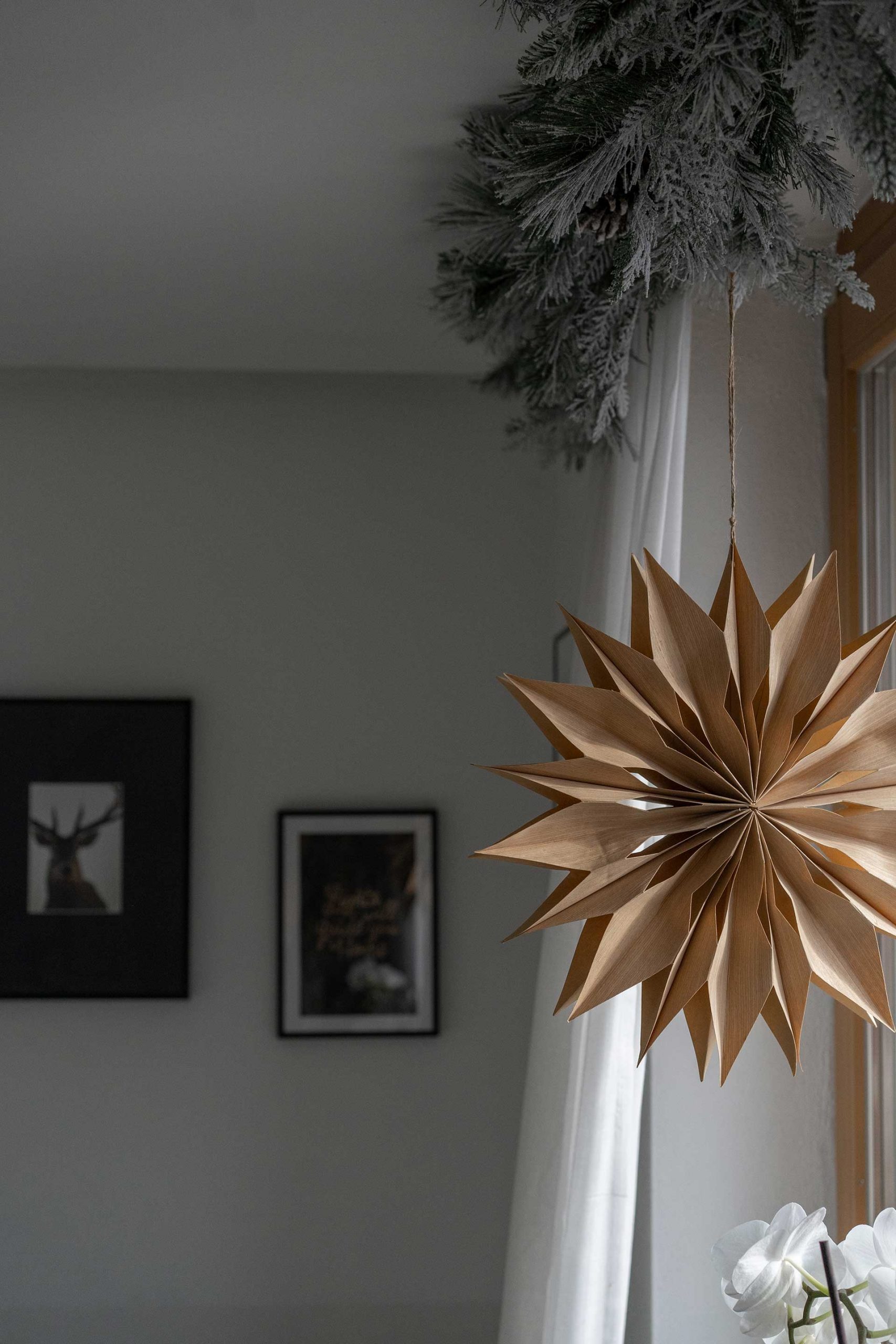 Scandinavian Living Room with a Large Paper Star Lantern and Art — Christmas Living Room Decor