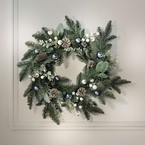 Festive Winter Pine Wreath with Silver Accents on White Wall Festive Winter Pine Wreath with Silver Accents on White Wall — Ornament Wreath