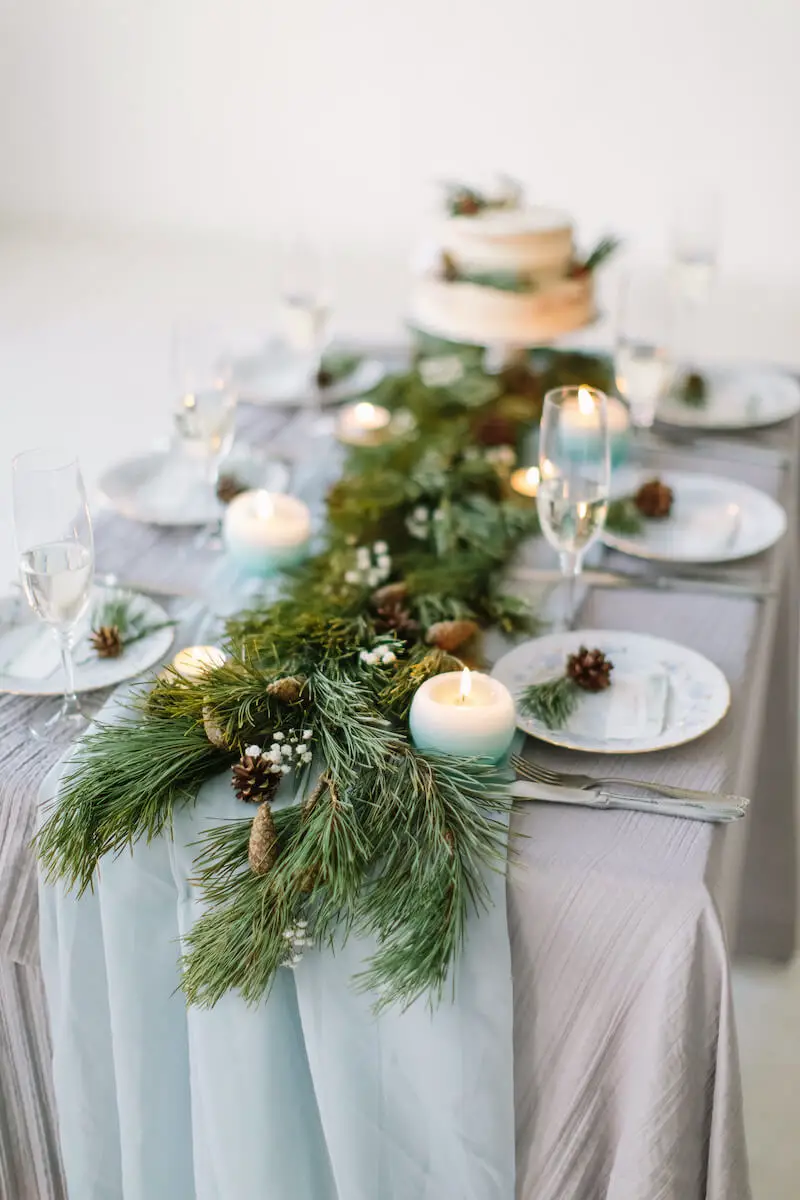 Winter Wedding Garland Centerpiece with Pinecones and Pale Blue Accents Winter Wedding Garland Centerpiece with Pinecones and Pale Blue Accents — Christmas Wedding Centerpiece