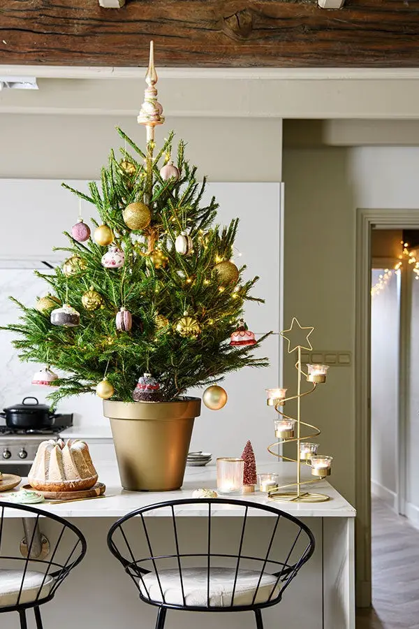 Compact Potted Christmas Tree with Gold and Pink Accents on a Kitchen Counter — Glam Christmas Tree