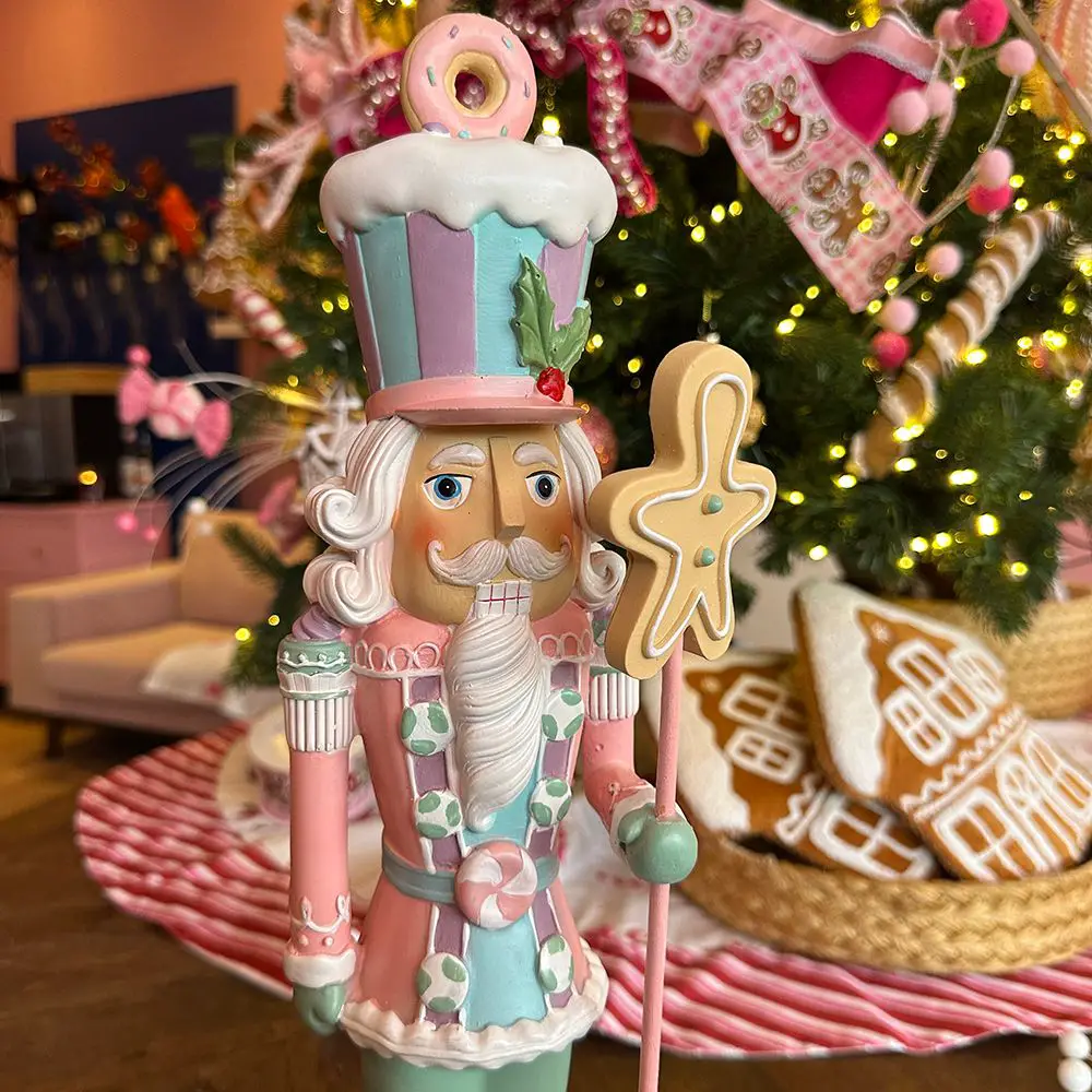Whimsical Pastel Nutcracker with Donut Hat by a Christmas Tree — Nutcracker Christmas Decor