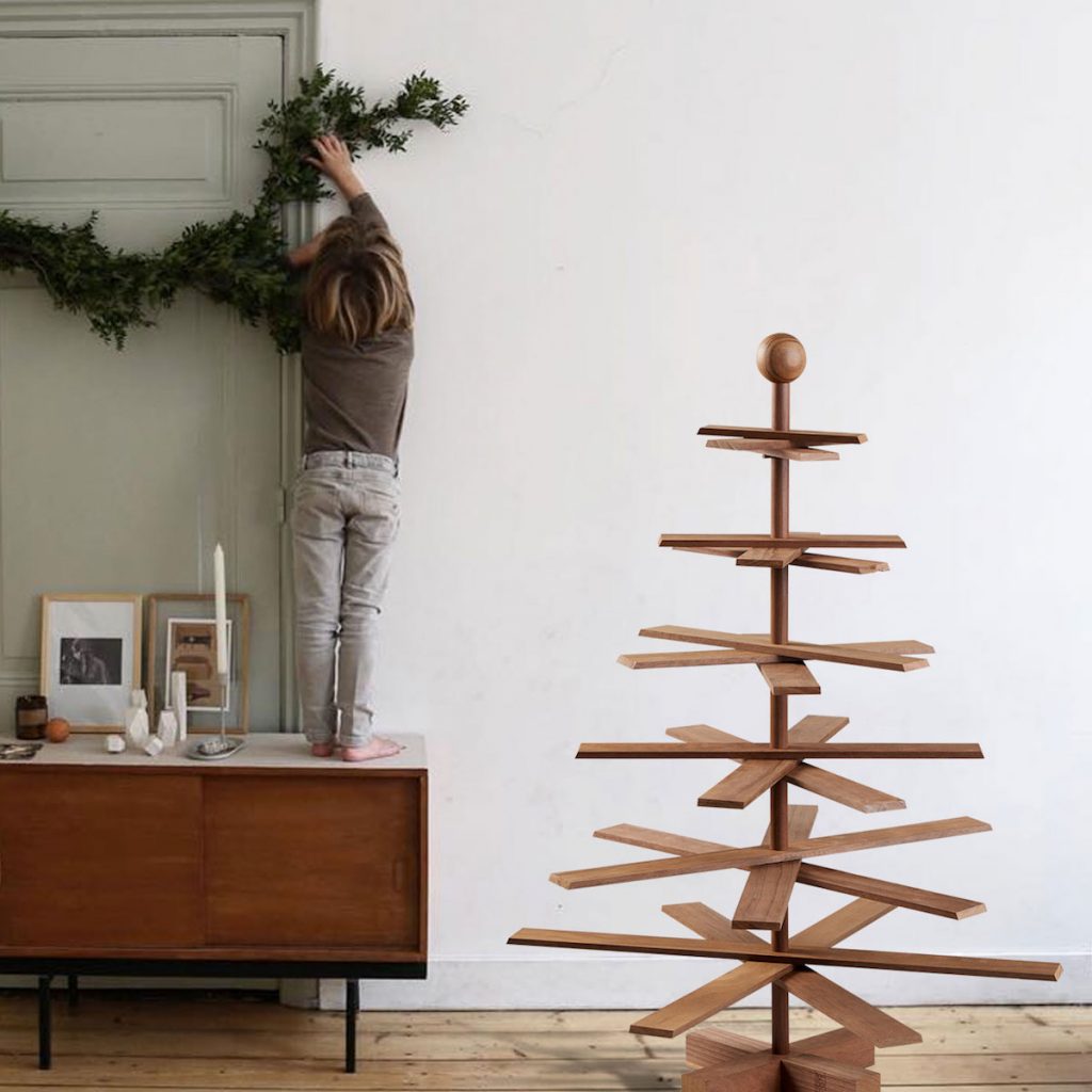 Child Decorating a Minimalist Wooden Christmas Tree Child Decorating a Minimalist Wooden Christmas Tree — Scandinavian Christmas Tree