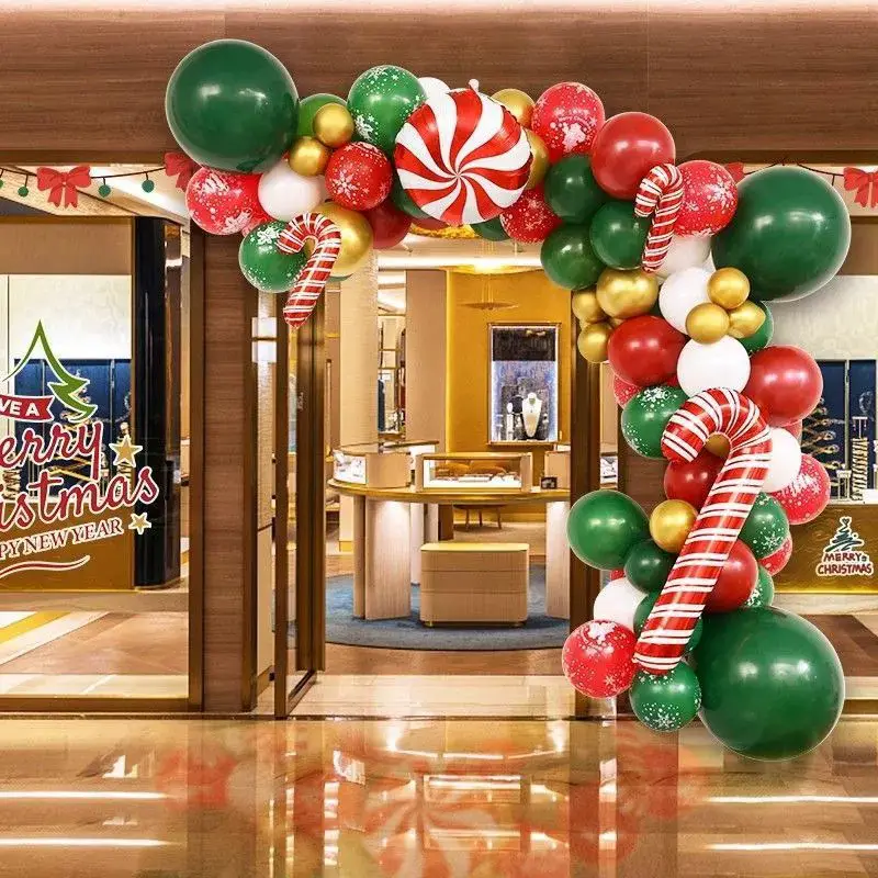 Large Green, Red, and Gold Balloon Garland Arching Over a Store Entrance — Christmas Balloon Garland