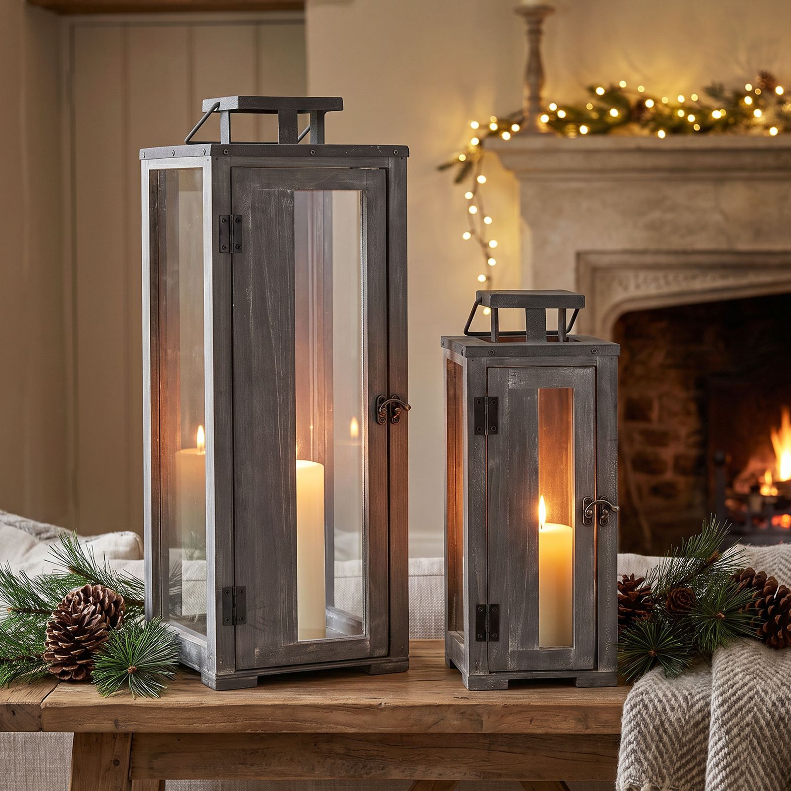 Rustic Wooden Lanterns with Pillar Candles and Festive Garland — Christmas Lantern Lights