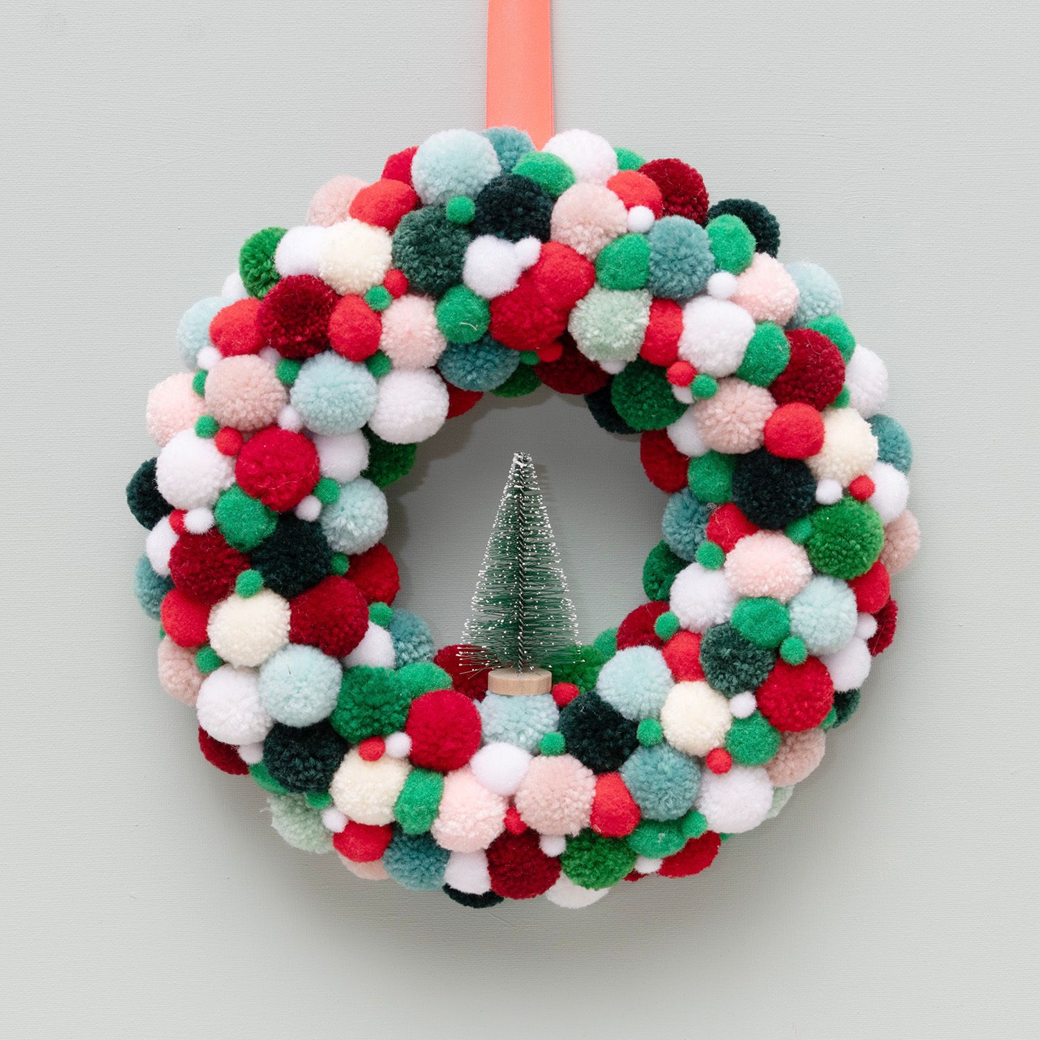 Vibrant DIY Pom-Pom Wreath with Miniature Tree — DIY Christmas Decor
