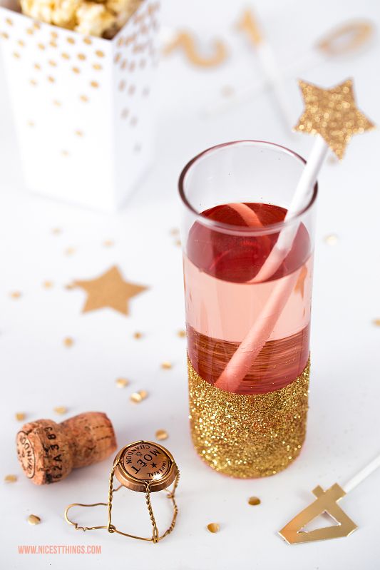 Festive Drink with Glitter-Encrusted Glass and Party Props Festive Drink with Glitter-Encrusted Glass and Party Props — New Years Eve Party Decor