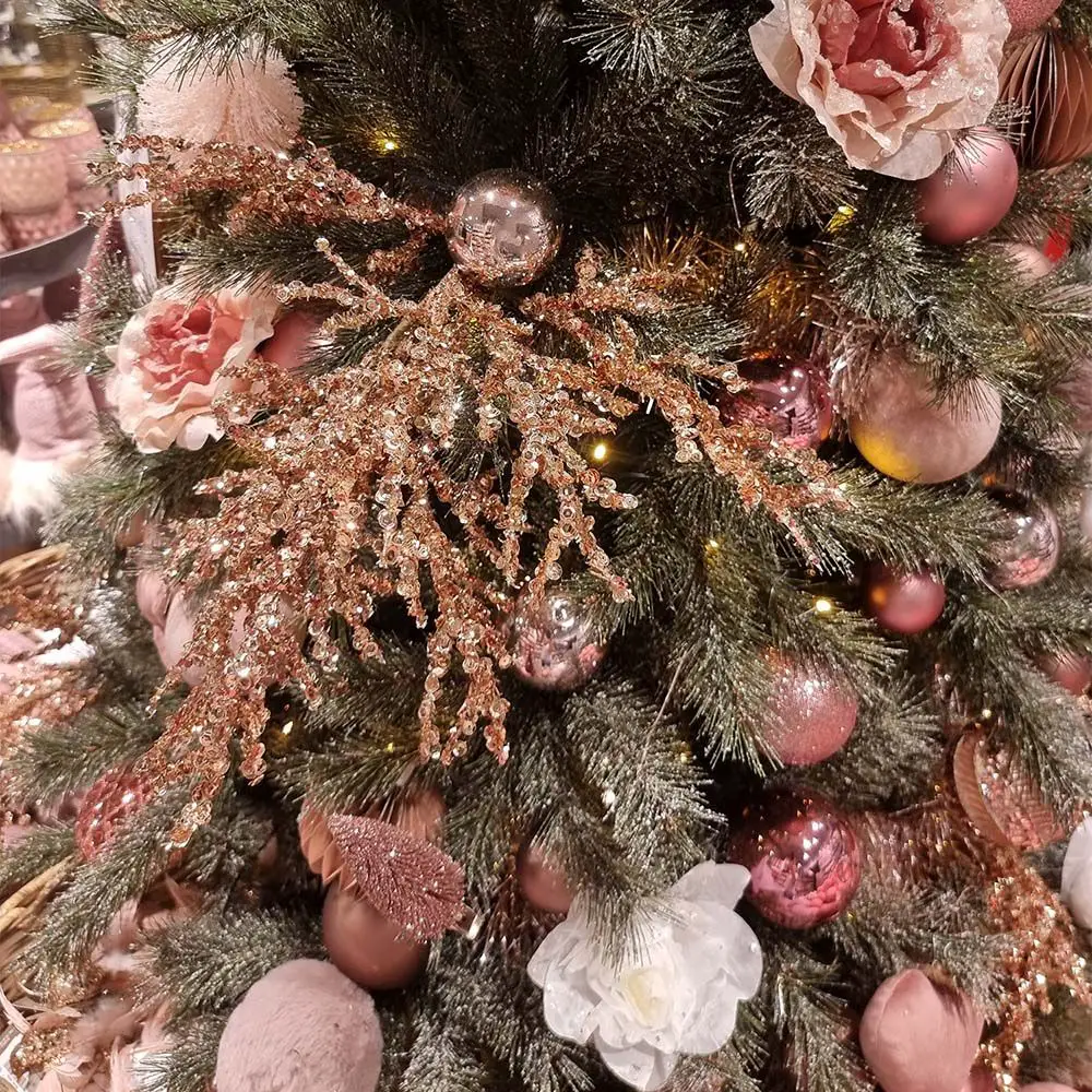 Sparkling Rose Gold Twig Ornament on a Flocked Branch — Pink and Gold Christmas Tree
