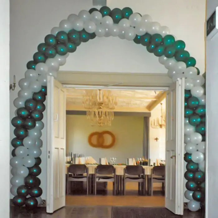 Classic White and Green Balloon Arch Framing a Doorway — New Years Eve Balloon Garland