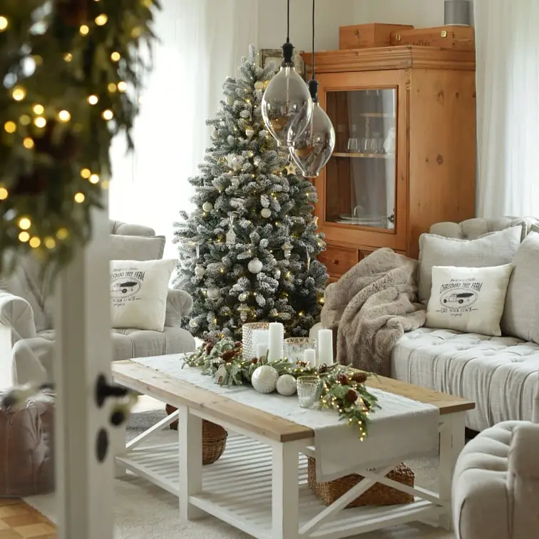 Flocked Farmhouse Christmas Tree in a Cozy Living Room Flocked Farmhouse Christmas Tree in a Cozy Living Room — Rustic Christmas Tree