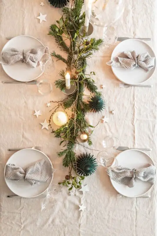 Festive Dining Table Runner with a Single Candle and Pine Garland — Christmas Candle Decor