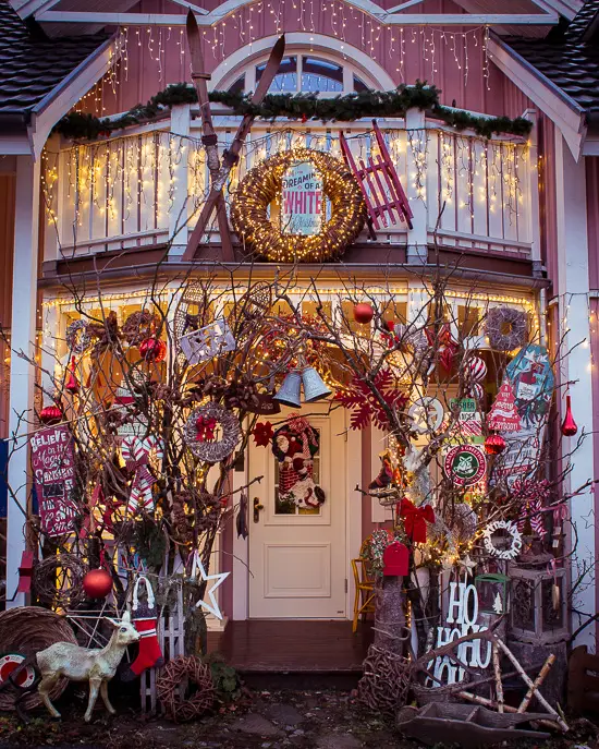 Festive Porch with Wreath, Skis, and String Lights Festive Porch with Wreath, Skis, and String Lights — Christmas Window Decor Outdoor
