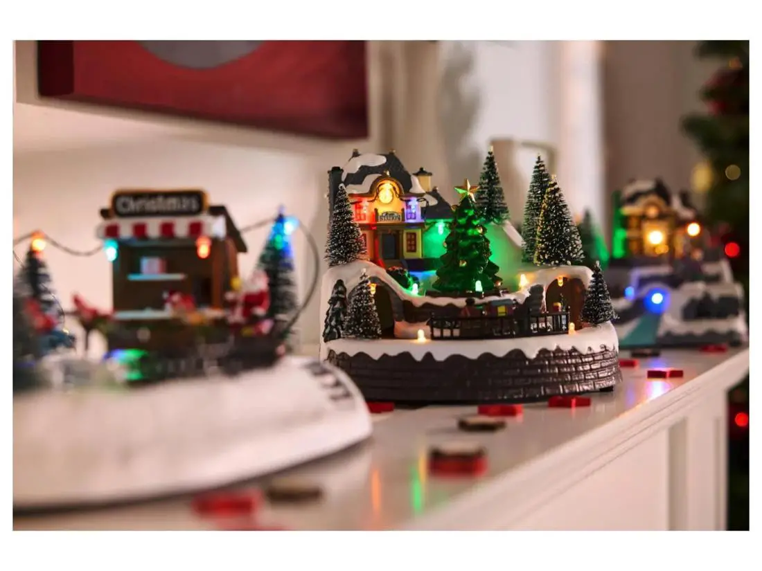 Traditional Village with Snow on a Mantelpiece — Christmas Village Display
