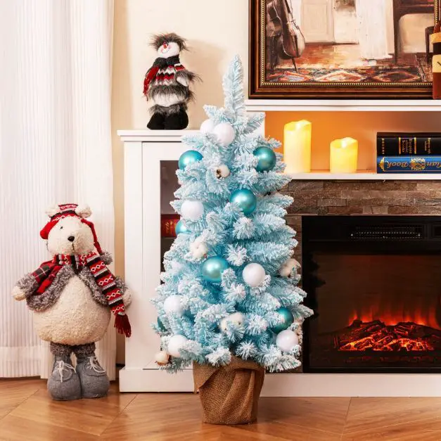Compact Blue Flocked Christmas Tree with Burlap Pot Compact Blue Flocked Christmas Tree with Burlap Pot — Winter Wonderland Christmas Tree