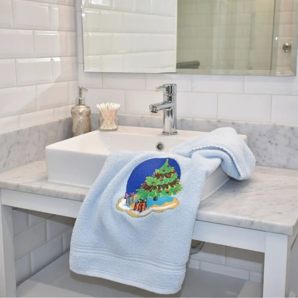 Embroidered Christmas Tree Towel on Marble Counter — Christmas Bathroom Decor