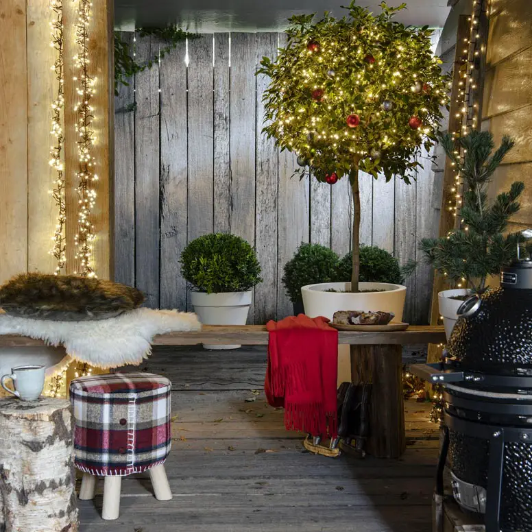 Cozy Porch with a Miniature Lit Christmas Tree — Christmas Yard Decor