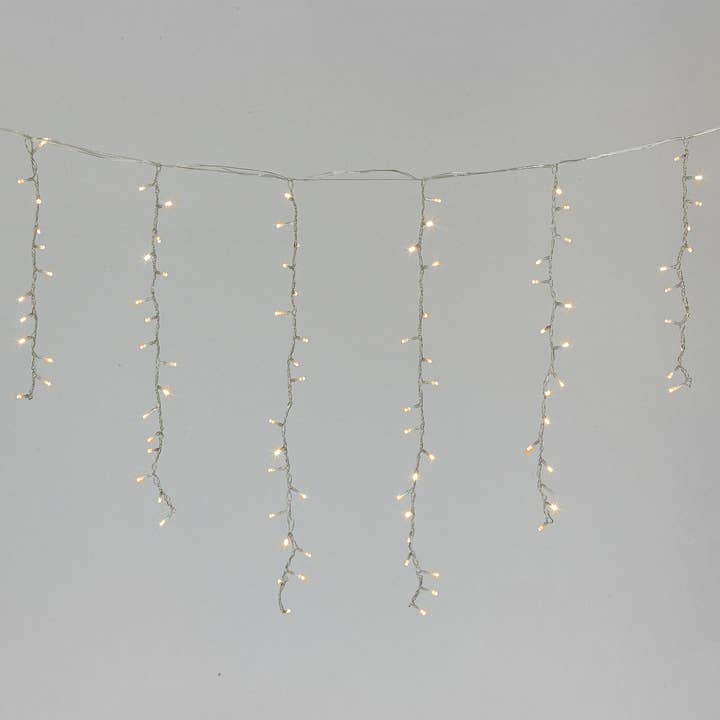 Soft Glow of Cascading Warm White Strands Soft Glow of Cascading Warm White Strands — Icicle Christmas Lights