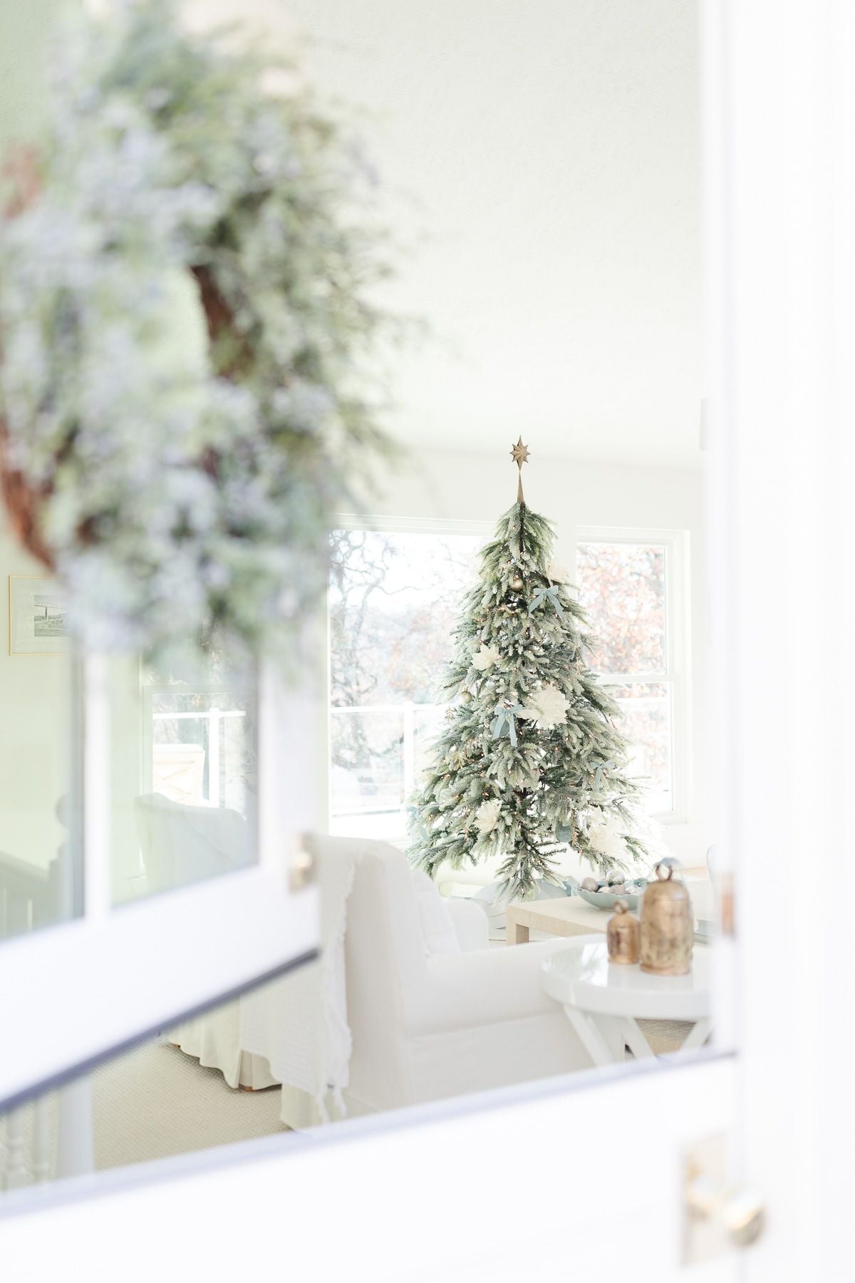 Bright Coastal Living Room with Frosted Christmas Tree Bright Coastal Living Room with Frosted Christmas Tree — Coastal Christmas Decor