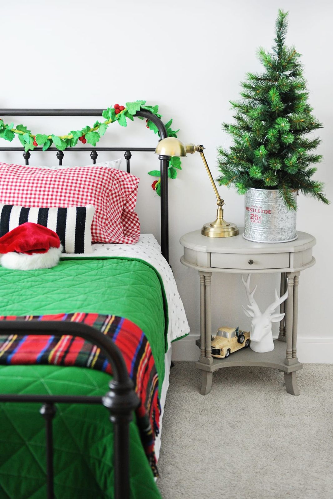 Traditional Bedroom with Green Quilt and Santa Hat Accent — Christmas Bedroom Decor