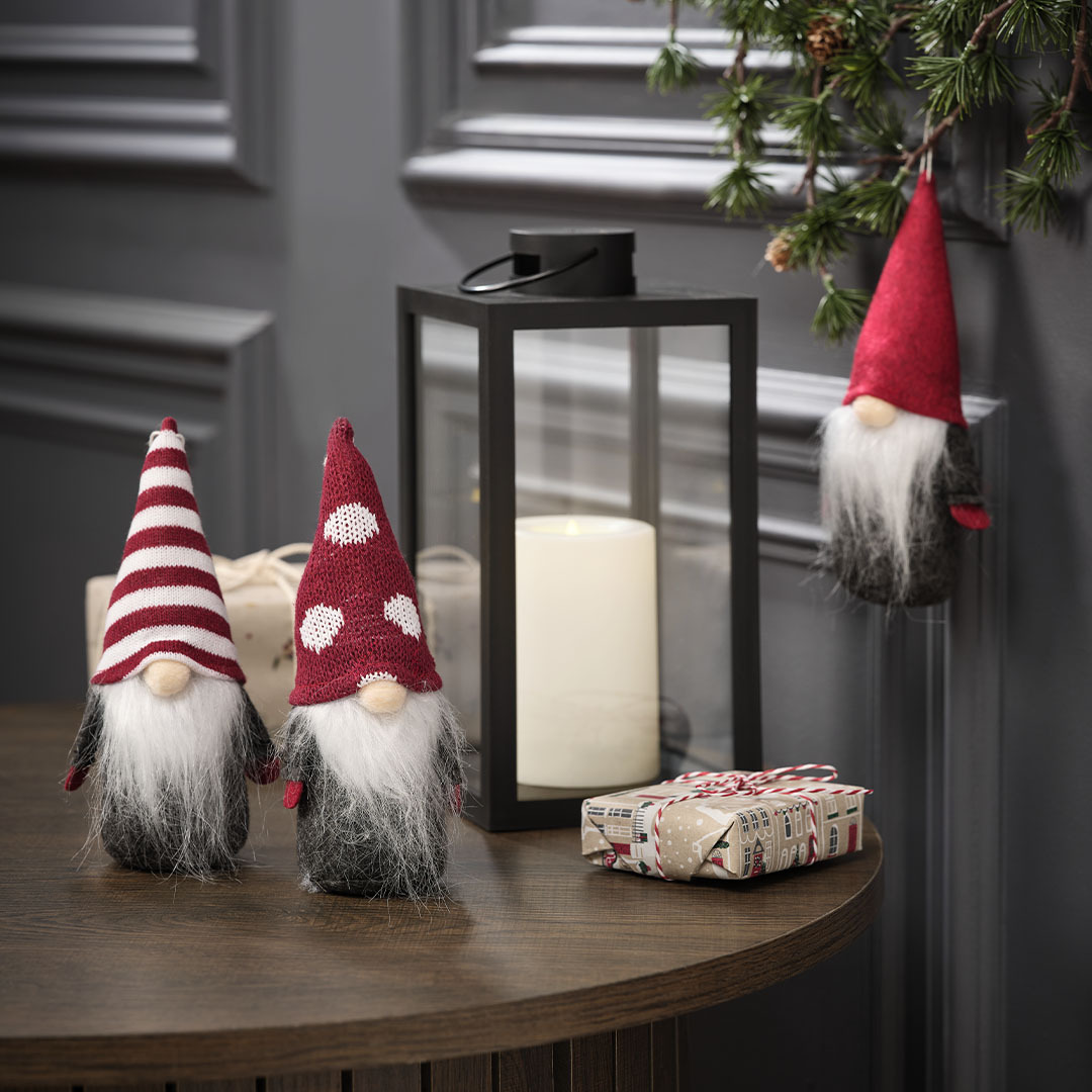 Whimsical Tabletop with Gnome Figurines and Lantern — Whimsical Christmas Decor