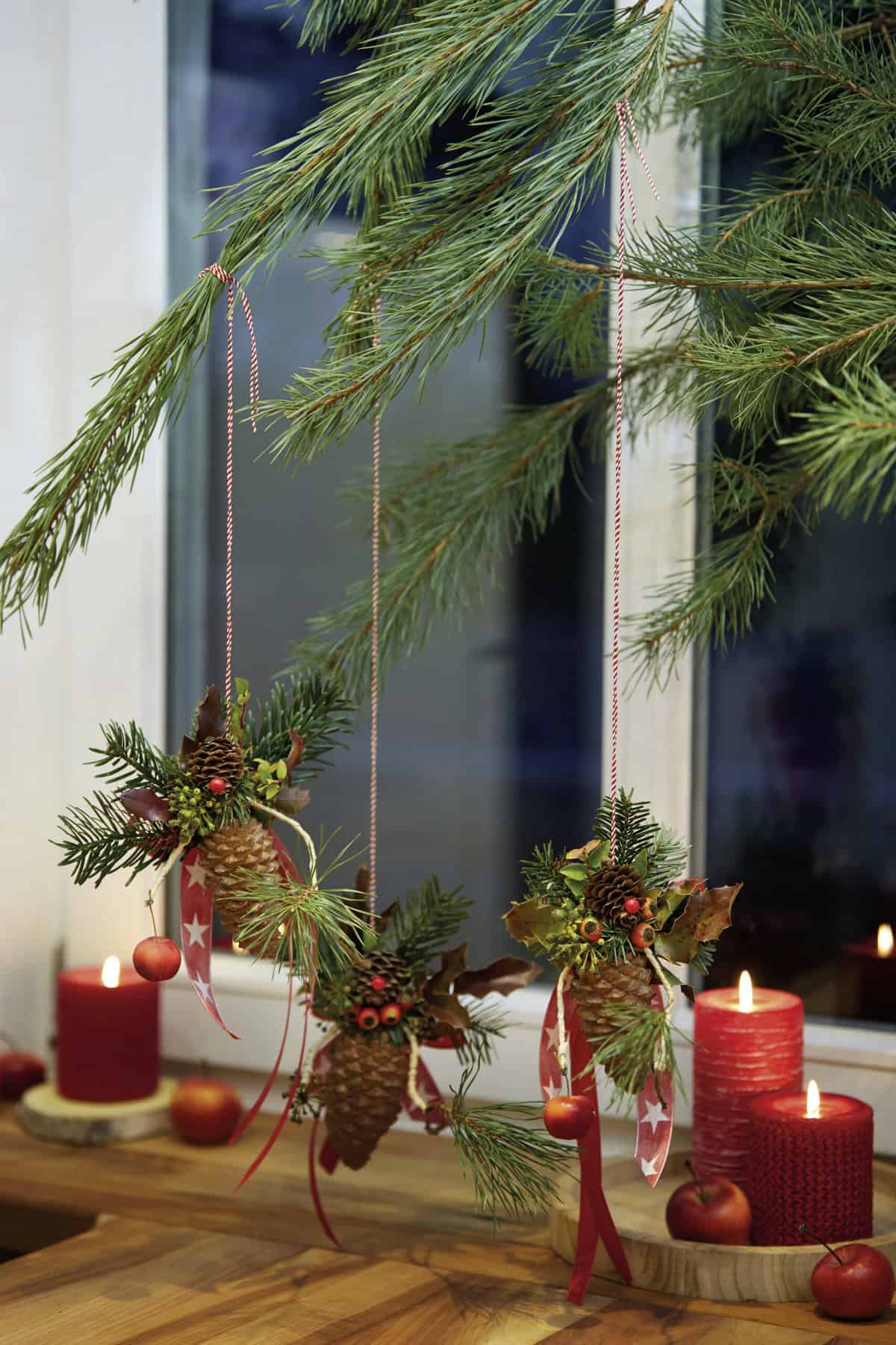 Rustic Window Sill with Pine Cone Ornaments — Red and Green Christmas Decor