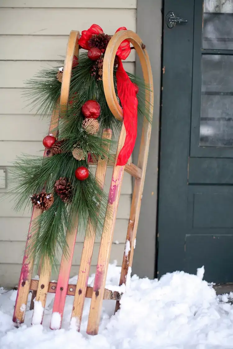 Vintage Sled with Festive Garland and Pinecones — Christmas Yard Decor