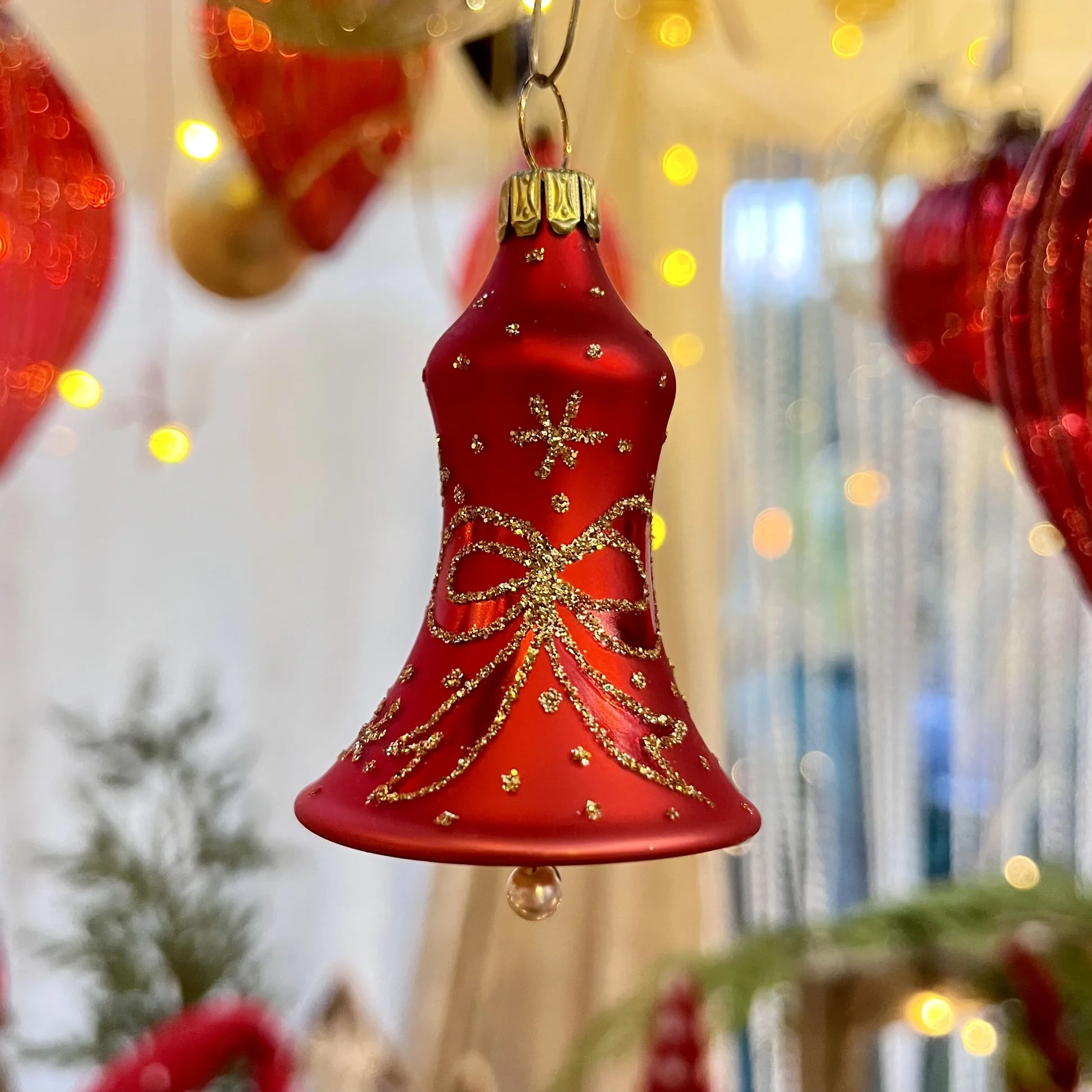 Ornate Red Glass Bell Ornament with Gold Glitter Detail Ornate Red Glass Bell Ornament with Gold Glitter Detail — Red and Gold Christmas Tree