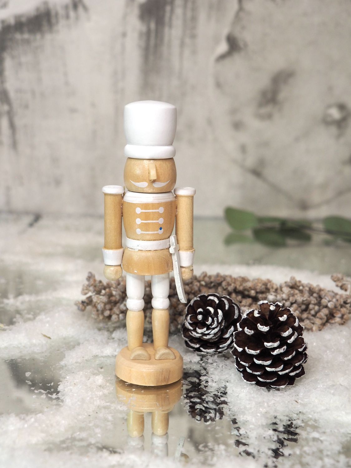 Classic Wooden Nutcracker with Snow and Pinecones — Nutcracker Display