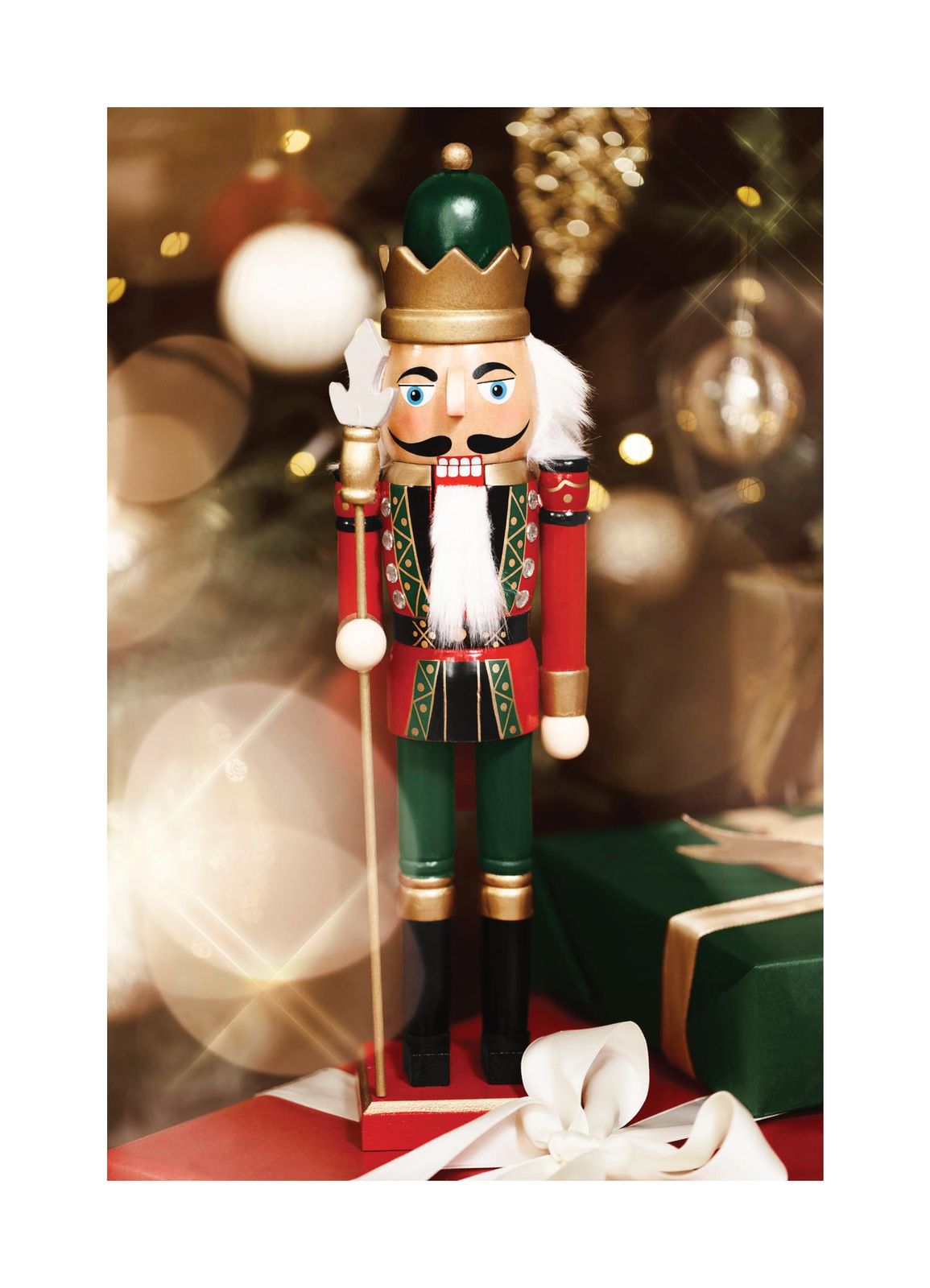 Traditional Nutcracker on Red and Green Gift Boxes — Nutcracker Display