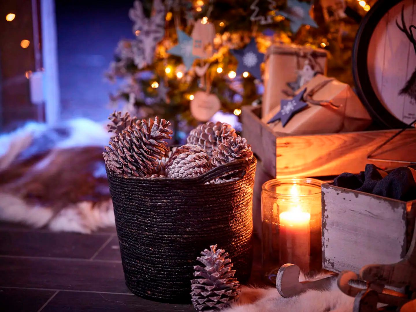 Rustic Basket Overflowing with Pinecones and a Candle Rustic Basket Overflowing with Pinecones and a Candle — Christmas Decor
