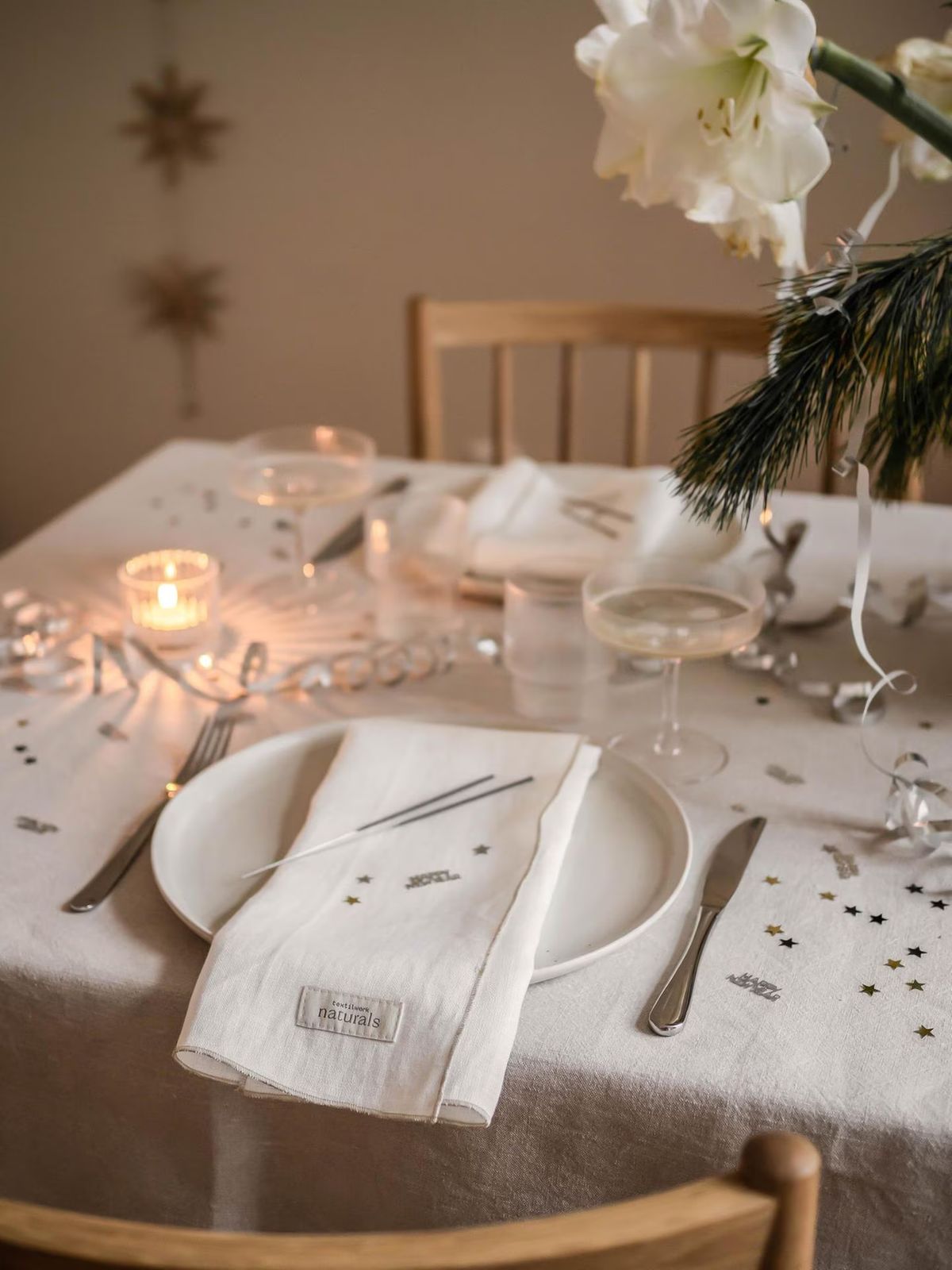 Modern Minimalist Table Setting with Textured Ceramics and Linen Modern Minimalist Table Setting with Textured Ceramics and Linen — New Years Eve Party Decor
