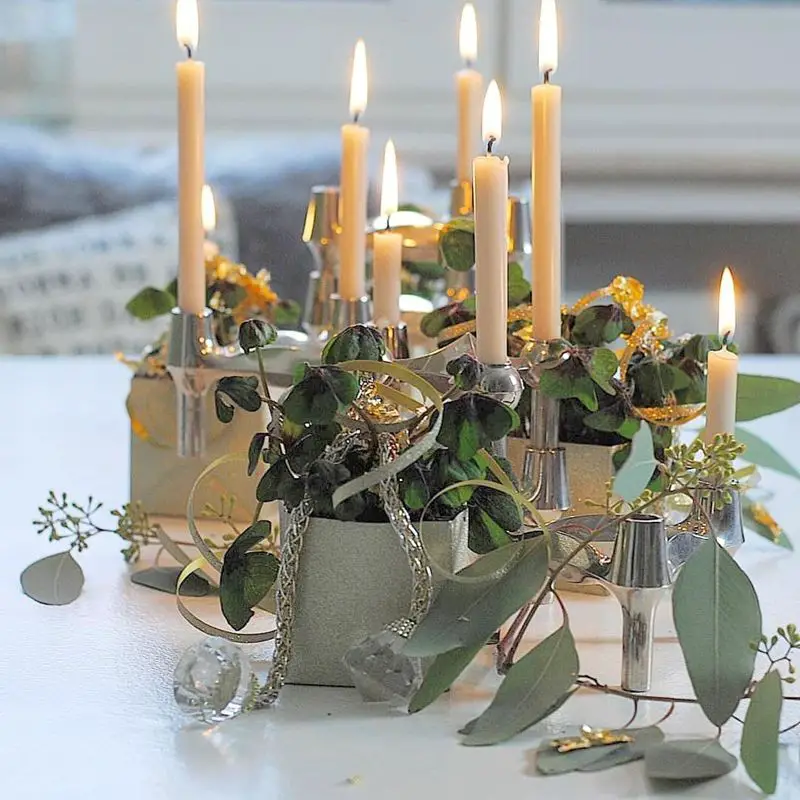 Greenery and Silver Centerpiece with Lit Candles Greenery and Silver Centerpiece with Lit Candles — New Years Eve Party Decor