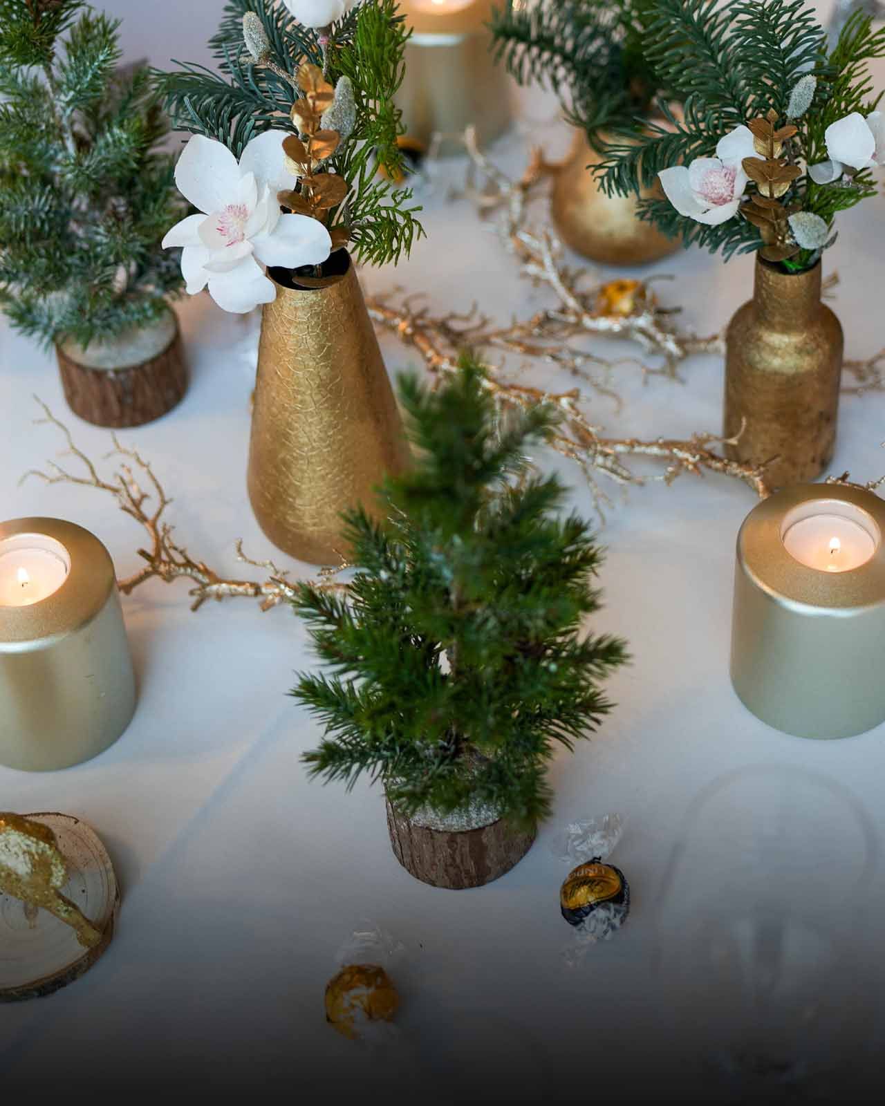 Elegant Gold Centerpieces with Miniature Trees and Candles Elegant Gold Centerpieces with Miniature Trees and Candles — Christmas Party Decor