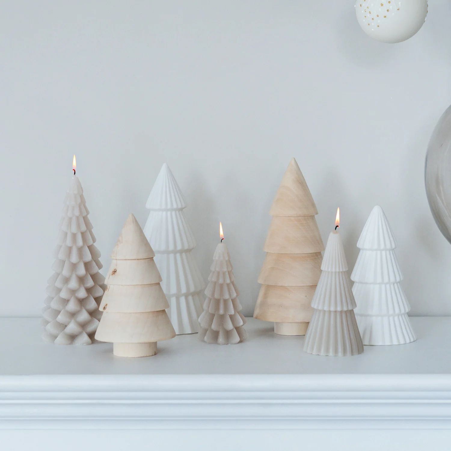 Modern Mantel with Tree-Shaped Candles and Wood Decor — Christmas Fireplace Decor