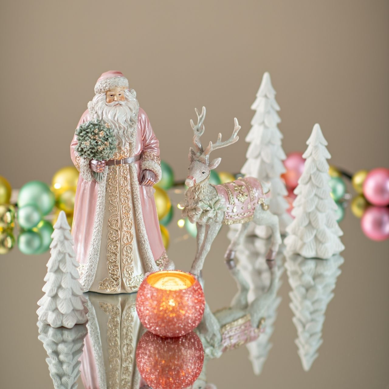 Charming Pink Santa and Reindeer Figurines for a Whimsical Scene Charming Pink Santa and Reindeer Figurines for a Whimsical Scene — Pink Christmas Decor